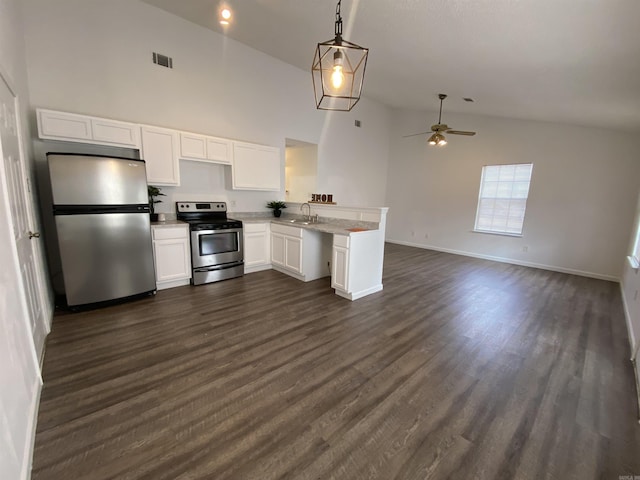 kitchen with appliances with stainless steel finishes, dark hardwood / wood-style flooring, ceiling fan, white cabinetry, and hanging light fixtures