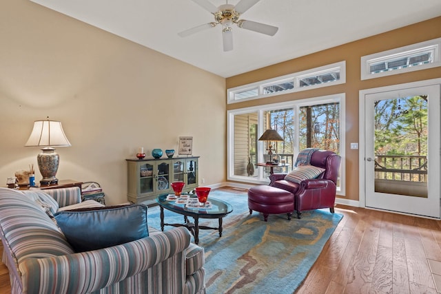 living room with hardwood / wood-style flooring and ceiling fan