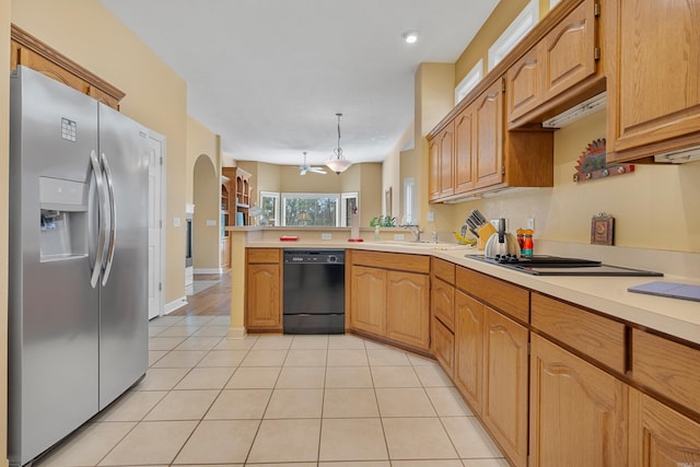 kitchen with hanging light fixtures, an inviting chandelier, kitchen peninsula, light tile patterned flooring, and appliances with stainless steel finishes