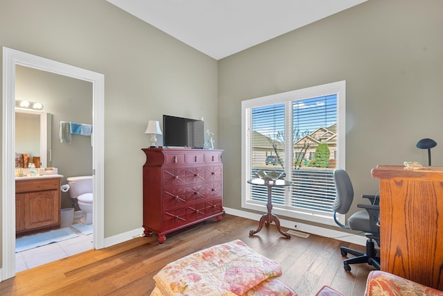 office space with light hardwood / wood-style floors