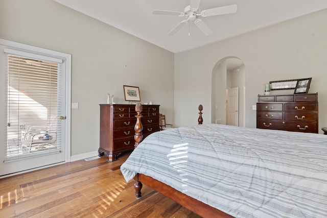 bedroom with access to outside, light hardwood / wood-style floors, and ceiling fan