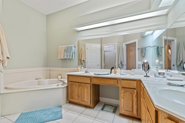 bathroom featuring a tub to relax in, tile patterned flooring, and vanity