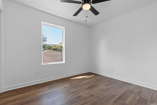 unfurnished room with ceiling fan and dark hardwood / wood-style floors