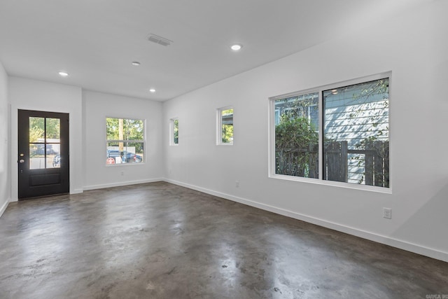 unfurnished room with a healthy amount of sunlight