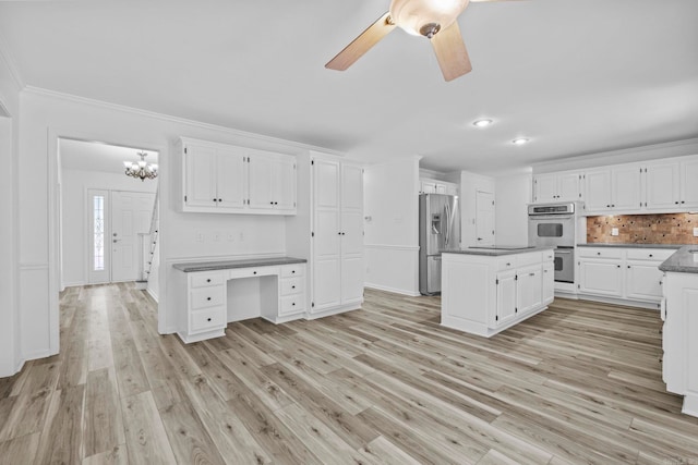 kitchen with stainless steel fridge with ice dispenser, light wood-type flooring, double wall oven, and white cabinetry