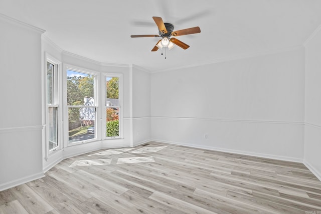 spare room with ceiling fan, light hardwood / wood-style floors, and ornamental molding