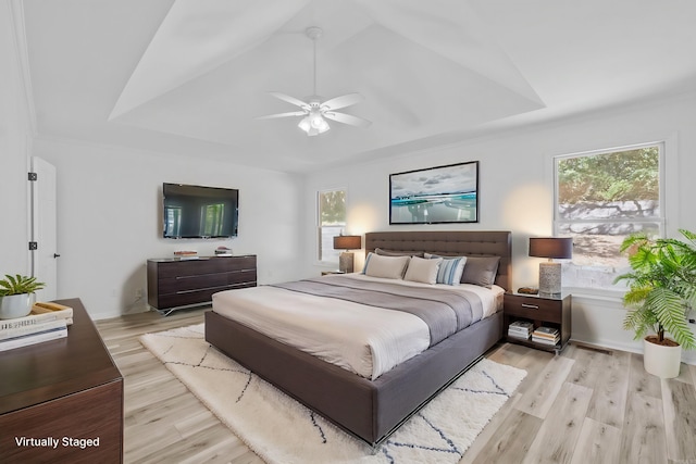 bedroom with light wood-type flooring, ceiling fan, and lofted ceiling