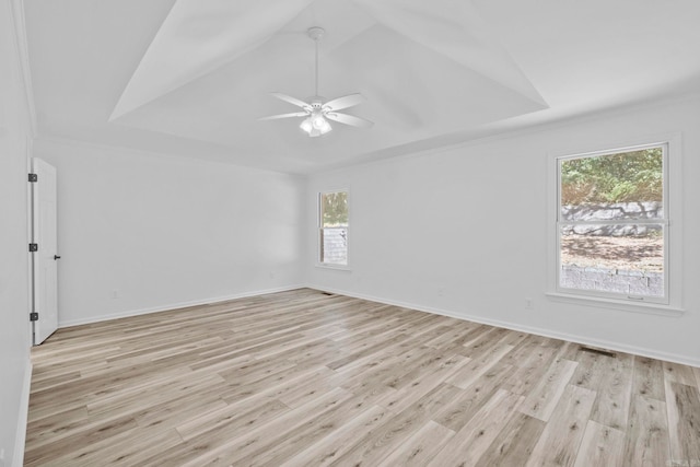 unfurnished room with light hardwood / wood-style flooring, ceiling fan, a healthy amount of sunlight, and crown molding