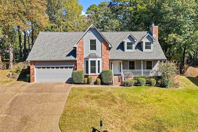 view of front of home with a porch, a garage, and a front lawn