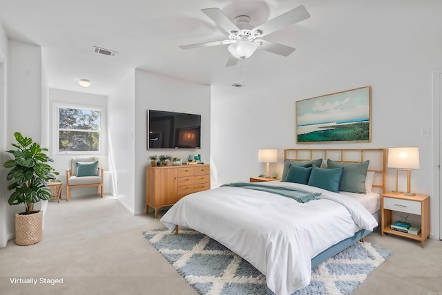 carpeted bedroom featuring ceiling fan