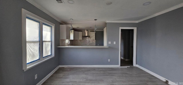 unfurnished living room with ornamental molding and dark wood-type flooring