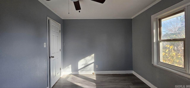 empty room featuring crown molding, ceiling fan, and dark wood-type flooring