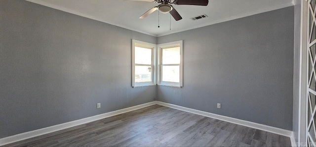 spare room with dark hardwood / wood-style floors, ceiling fan, and crown molding