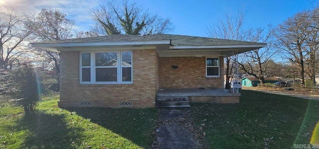 view of front of home with a front lawn and a patio area