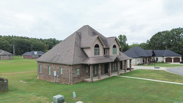 view of front of property featuring a porch and a front yard