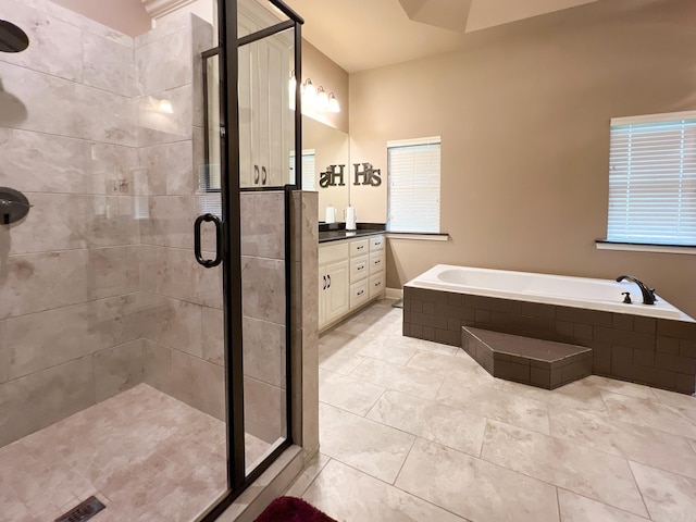 bathroom featuring tile patterned flooring, vanity, and independent shower and bath