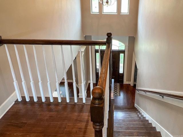 stairway with hardwood / wood-style flooring