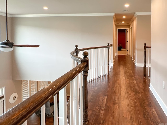 hall featuring dark wood-type flooring and ornamental molding