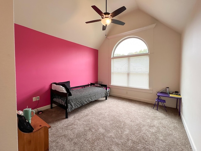 carpeted bedroom with ceiling fan and lofted ceiling