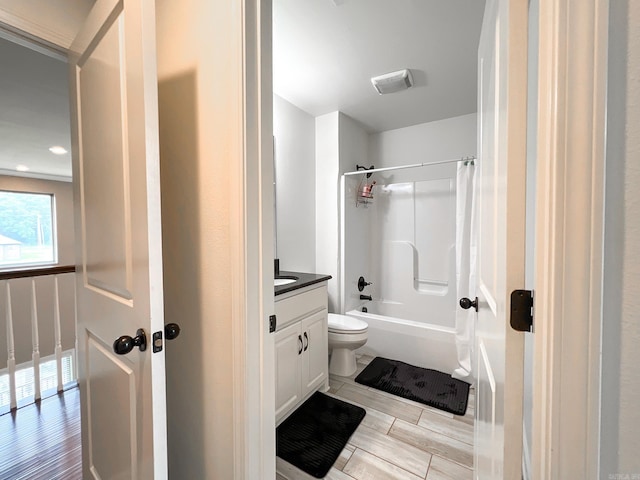 full bathroom with shower / bath combo with shower curtain, vanity, and toilet