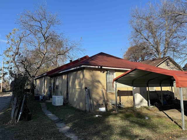 view of home's exterior featuring a carport