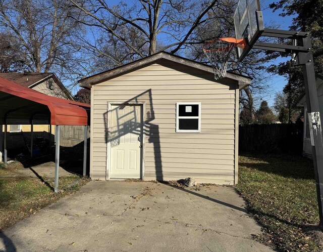 view of outbuilding featuring a carport