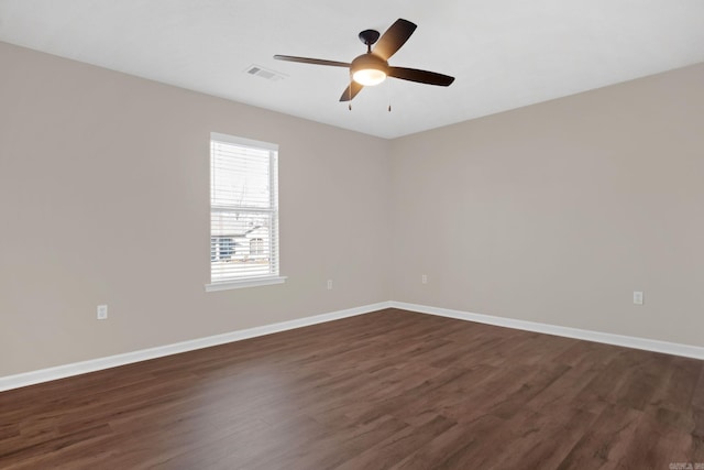 empty room featuring dark hardwood / wood-style floors and ceiling fan