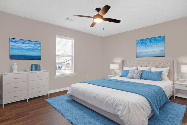 bedroom featuring ceiling fan and dark hardwood / wood-style flooring