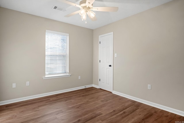 unfurnished room with hardwood / wood-style floors and ceiling fan