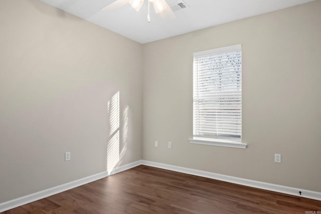 unfurnished room featuring ceiling fan and dark hardwood / wood-style flooring