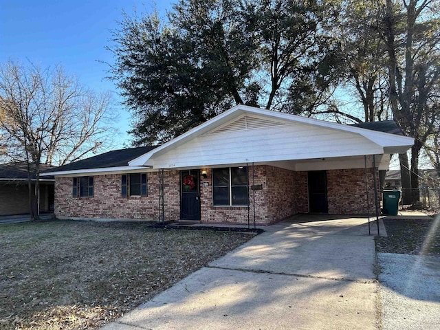 ranch-style home with a carport