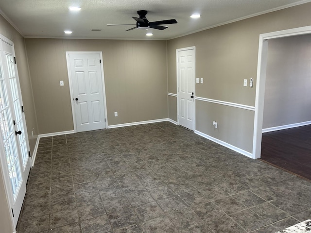 spare room with french doors, ceiling fan, and crown molding