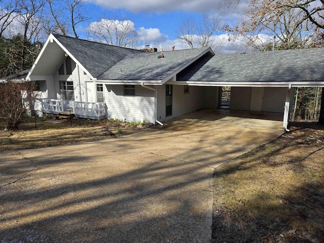 view of home's exterior with a carport