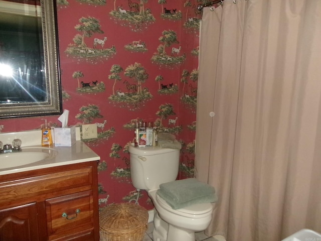 bathroom featuring vanity and toilet