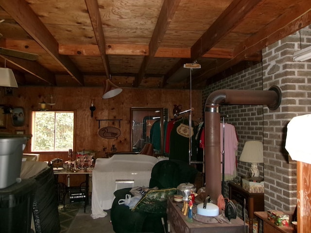 interior space with wood ceiling, wooden walls, brick wall, and beam ceiling