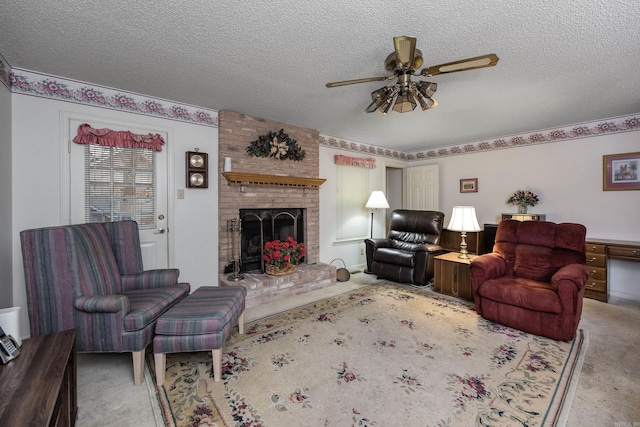 living room featuring a fireplace, a textured ceiling, ceiling fan, and carpet flooring