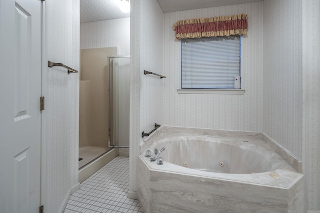 bathroom featuring tile patterned flooring, a textured ceiling, and separate shower and tub