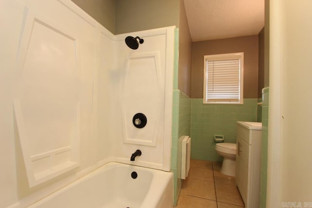 bathroom with tile patterned floors, toilet, tile walls, shower / bathtub combination, and radiator heating unit