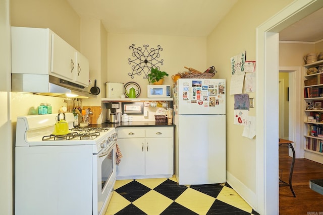 kitchen with white cabinets and white appliances