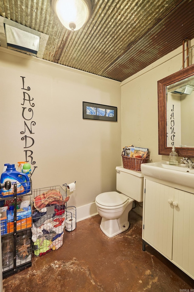 bathroom with vanity, toilet, concrete flooring, and wood ceiling