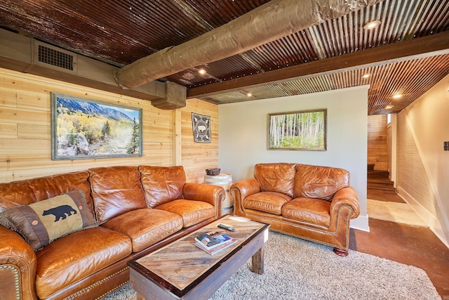 living room featuring beamed ceiling, wood ceiling, and wood walls