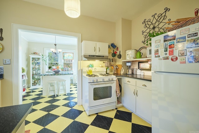 kitchen with white cabinetry, white appliances, and an inviting chandelier