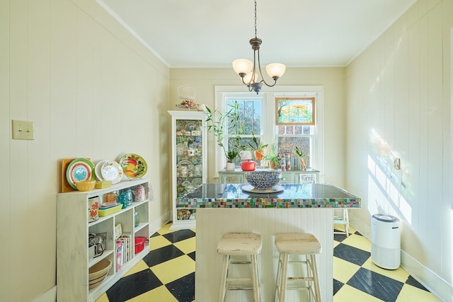 interior space with a notable chandelier and crown molding