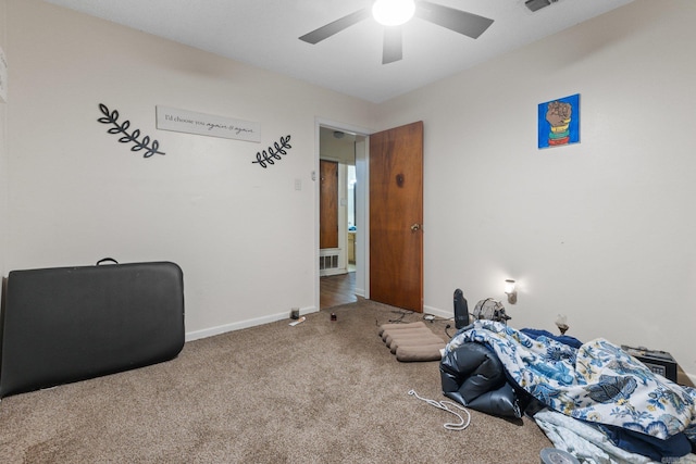 interior space with carpet flooring and ceiling fan