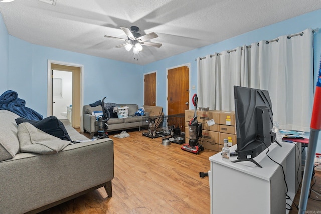 office featuring ceiling fan, wood-type flooring, and a textured ceiling