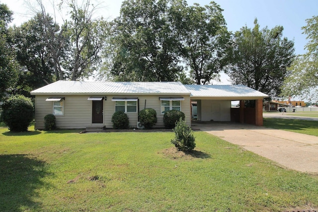 ranch-style home with a carport and a front lawn