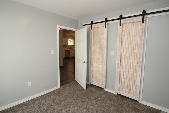 unfurnished bedroom with dark carpet