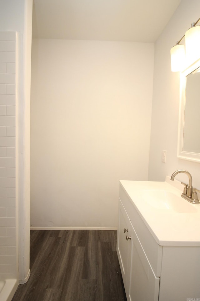 bathroom featuring hardwood / wood-style floors and vanity