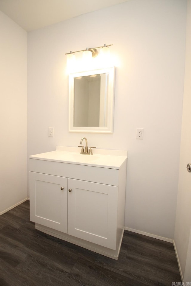 bathroom featuring vanity and hardwood / wood-style flooring