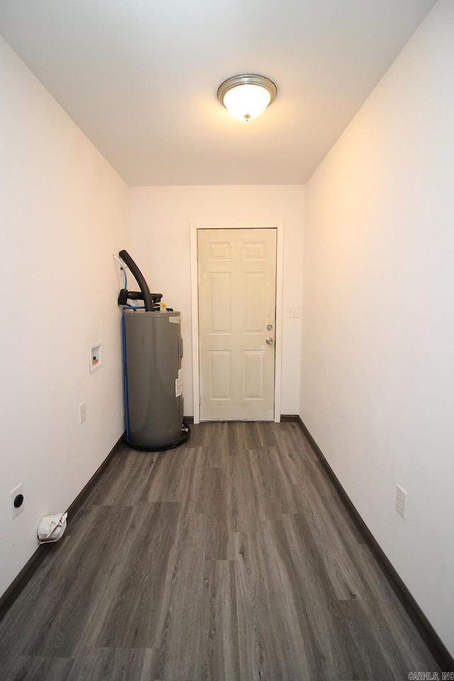 entryway with electric water heater and dark hardwood / wood-style flooring